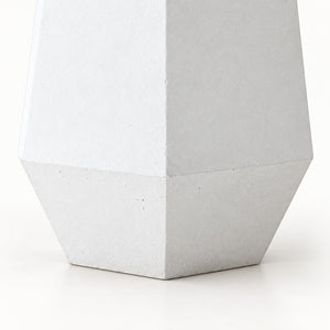 Six Edges cement planter — exterior angular faces and tapered lower band