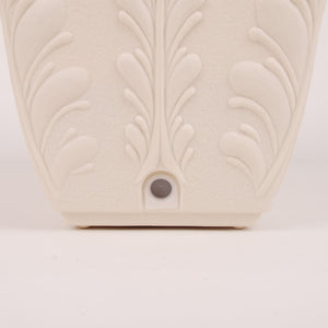 Drainage detail on cream PRM planter