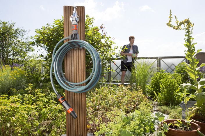 a blue and orange hose connected to a white cord