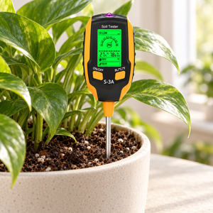 S-3A soil tester inserted into the soil of a potted houseplant beside a window