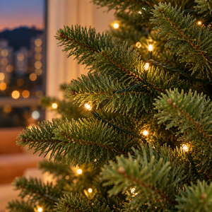 Warm-white string lights on Noble Fir branches — lighting effect
