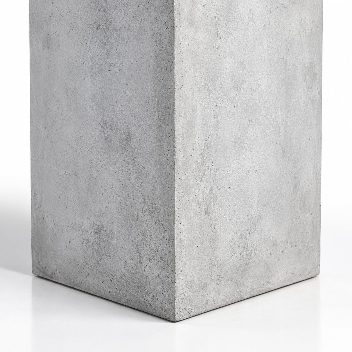 Tall square cement planter exterior corner and surface detail