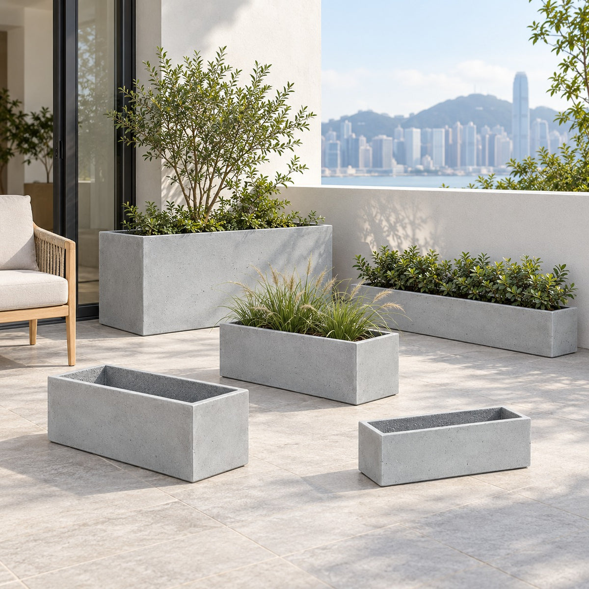 Five rectangular cement planters in a terrace setting with a chair for scale