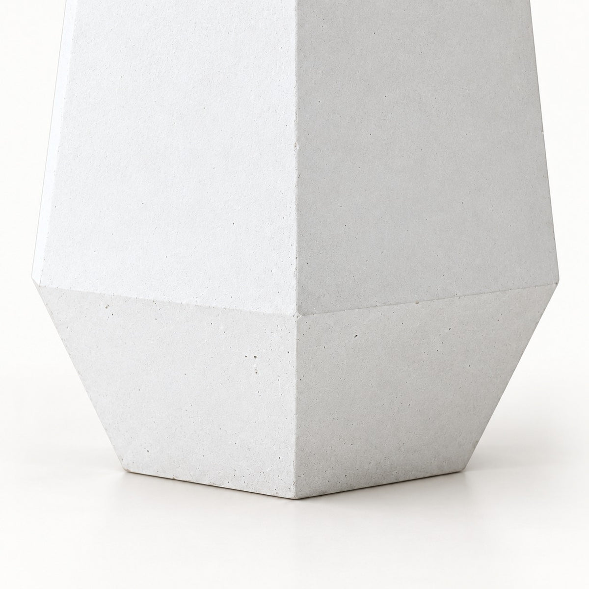 Six Edges cement planter — exterior angular faces and tapered lower band