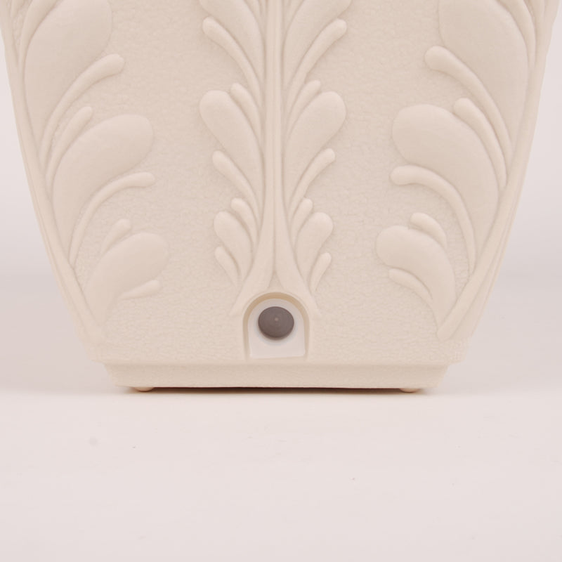 Drainage detail on cream PRM planter