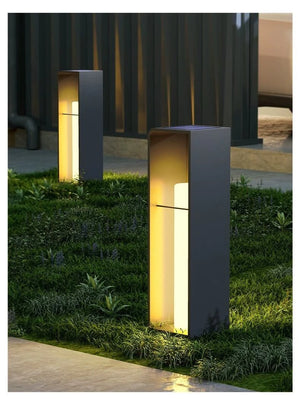 a couple of lights that are in the grass