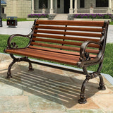 a wooden bench sitting on top of a stone walkway